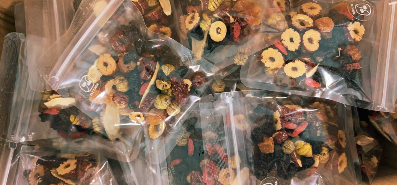 Sealed sachets of Still — dried apple and pear slices with chrysanthemum